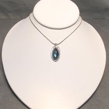 Load image into Gallery viewer, Our Daphne necklaces all feature a stunning deep blue marquise cut Labradorites. This royal hue is one of the most desired shades of the stone and looks stunning set in silver. This Daphne is set in a sleek shadowbox with hand-carved notches that reference an Art-Deco aesthetic. A simple arched bail provides a sleek connection to a smooth, round, foxtail chain.