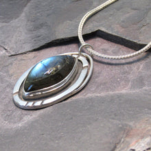Load image into Gallery viewer, Our Daphne necklaces all feature a stunning deep blue marquise cut Labradorites. This royal hue is one of the most desired shades of the stone and looks stunning set in silver. This Daphne is set in a sleek shadowbox with hand-carved notches that reference an Art-Deco aesthetic. A simple arched bail provides a sleek connection to a smooth, round, foxtail chain.