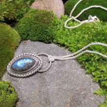 Load image into Gallery viewer, Our Daphne necklaces all feature a stunning deep blue marquise cut Labradorites. This royal hue is one of the most desired shades of the stone and looks stunning set in silver.  This Daphne is wrapped by a silver twist and crowned with a large circular bail through which a shimmery silver chain is looped