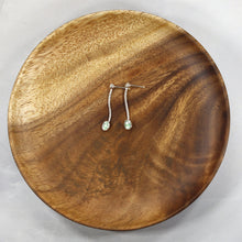 Load image into Gallery viewer, Delicate dangly stud earrings with luminous bezel-set Russian Emeralds hanging on foxtail chain from a hand-textured silver ball.