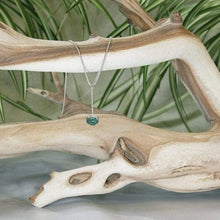 Load image into Gallery viewer, A rich green raw emerald dangles from a tiny glowing labradorite. This y-shaped necklace is perfect for deep necklines and adding the perfect amount of color without overwhelming your look!