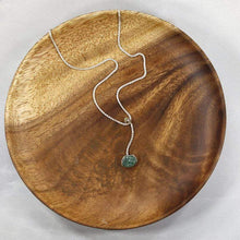 Load image into Gallery viewer, A rich green raw emerald dangles from a tiny glowing labradorite. This y-shaped necklace is perfect for deep necklines and adding the perfect amount of color without overwhelming your look!
