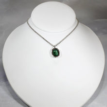 Load image into Gallery viewer, A beautiful hand-cut emerald is showcased in a simple banded bezel - geometric but still natural. A thicker rolo chain balances out the small but solid pendant and a two-inch extender gives you flexibility with different necklines.