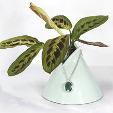 Load image into Gallery viewer, A beautiful hand-cut emerald is showcased in a simple banded bezel - geometric but still natural. A thicker rolo chain balances out the small but solid pendant and a two-inch extender gives you flexibility with different necklines.