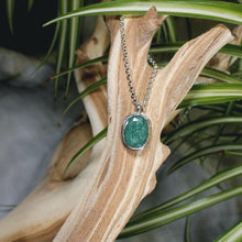 Load image into Gallery viewer, A beautiful hand-cut emerald is showcased in a simple banded bezel - geometric but still natural. A thicker rolo chain balances out the small but solid pendant and a two-inch extender gives you flexibility with different necklines.