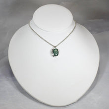 Load image into Gallery viewer, A beautiful hand-cut emerald is showcased in a simple banded bezel - geometric but still natural. A thicker rolo chain balances out the small but solid pendant and a two-inch extender gives you flexibility with different necklines.