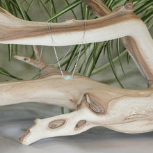 Load image into Gallery viewer, The Evie necklace brings the perfect tiny highlight to your look. The lovely mint-green rosecut Russian Emerald is nestled in a delicate diamond-cut sterling silver chain for extra sparkle.