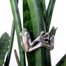 Load image into Gallery viewer, This adorable little tree frog clings to your finger with oversized toes, happy to bring a shine to your hand and a smile to your face! Looking like it just hopped out of a silver rainforest, your new Morelets Tree Frog ring will add a bit of bounce to your look!  We donate a portion of all WildWhere sales to support continuing wildlife conservation efforts!