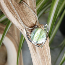 Load image into Gallery viewer, Faye features delicate handcrafted wings to frame this necklace’s substantial eye-catching Green Opal. A beautiful spring green, the stone is striped with shimmering bands and accented by a tiny drop of yellow-green labradorite.