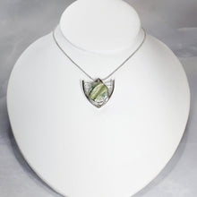 Load image into Gallery viewer, Faye features delicate handcrafted wings to frame this necklace’s substantial eye-catching Green Opal. A beautiful spring green, the stone is striped with shimmering bands and accented by a tiny drop of yellow-green labradorite.