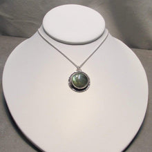 Load image into Gallery viewer, This Jaida necklace has an earthy, organic feel with its blue-green Labradorite centered in an antiqued shadowbox framed by a hand-textured halo. The sleek silver wheat chain lets the pendant steal the show while still providing elegance and strength.