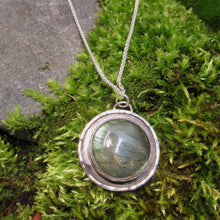 Load image into Gallery viewer, This Jaida necklace has an earthy, organic feel with its blue-green Labradorite centered in an antiqued shadowbox framed by a hand-textured halo. The sleek silver wheat chain lets the pendant steal the show while still providing elegance and strength.
