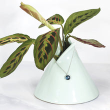 Load image into Gallery viewer, These sweet little pendant features an ethically sourced rosecut Teal Kyanite set in a simple recycled silver bezel. At 9mm wide, it is the perfect size for everyday wear while still adding a flash of sparkle to your look! This necklace pairs perfectly with the Luna Teal Kyanite Studs