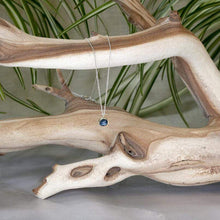 Load image into Gallery viewer, These sweet little pendant features an ethically sourced rosecut Teal Kyanite set in a simple recycled silver bezel. At 9mm wide, it is the perfect size for everyday wear while still adding a flash of sparkle to your look! This necklace pairs perfectly with the Luna Teal Kyanite Studs