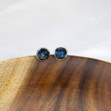 Load image into Gallery viewer, These sweet little earrings feature ethically sourced rosecut Teal Kyanite set in a simple recycled silver bezel. At 9mm wide, they are the perfect size for everyday wear while still adding a flash of sparkle  to your look! These earrings pair perfectly with the Luna Teal Kyanite Necklace.