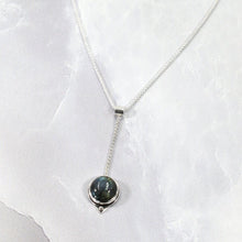 Load image into Gallery viewer, With its exceptional deep blue Labradorite, Taylor carries a mystical hint of midnight. Dangling from a wheat chain and accented by a thin silver band and tiny silver pebble, this necklace is delicate but eye-catching.