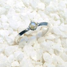 Load image into Gallery viewer, A tiny 3-mm Labradorite set in a delicate 4-prong setting on a solid Sterling Silver knife-edge band. The inside of the band is rounded for a comfortable fit.  A comfortable, easy-wearing band with a touch of shimmer, perfect for stacking with other rings or alone for a classic look