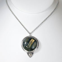 Load image into Gallery viewer, This gorgeous Valarie necklace will be the center of your outfit. A large deep green labradorite with flashy golden stripes is surrounded by a peaked ring of silver and accented by a tiny labradorite set on a hand-textured backer. Delicately hand-cut vine patterns on the back give this piece an extra custom feel.