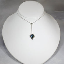 Load image into Gallery viewer, With its exceptional deep blue Labradorite, Taylor carries a mystical hint of midnight. Dangling from a wheat chain and accented by a thin silver band and tiny silver pebble, this necklace is delicate but eye-catching.