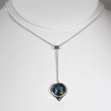 Load image into Gallery viewer, With its exceptional deep blue Labradorite, Taylor carries a mystical hint of midnight. Dangling from a wheat chain and accented by a thin silver band and tiny silver pebble, this necklace is delicate but eye-catching.