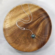 Load image into Gallery viewer, With its exceptional deep blue Labradorite, Taylor carries a mystical hint of midnight. Dangling from a wheat chain and accented by a thin silver band and tiny silver pebble, this necklace is delicate but eye-catching.