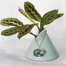 Load image into Gallery viewer, The Johnna necklace is minimal in form and maximal in impact. A delicate peaked silver band holds this large, flashy, aqua Labradorite in its rightful place, front and center. With plenty of color this piece will add glam to any look, while its soft turquoise and denim hues will be easy to style with your wardrobe staples.