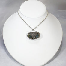 Load image into Gallery viewer, The Johnna necklace is minimal in form and maximal in impact. A delicate peaked silver band holds this large, flashy, aqua Labradorite in its rightful place, front and center. With plenty of color this piece will add glam to any look, while its soft turquoise and denim hues will be easy to style with your wardrobe staples.