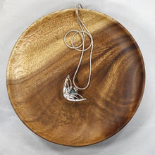 Load image into Gallery viewer, the labradorite Faye necklace evokes the new moon and gliding wings. The deep blue labradorite cabochon has exceptional dimension and hints of aqua and gold. The detailing detailing on the back makes this piece a 360º treasure.