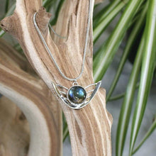 Load image into Gallery viewer, the labradorite Faye necklace evokes the new moon and gliding wings. The deep blue labradorite cabochon has exceptional dimension and hints of aqua and gold. The detailing detailing on the back makes this piece a 360º treasure.