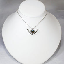 Load image into Gallery viewer, the labradorite Faye necklace evokes the new moon and gliding wings. The deep blue labradorite cabochon has exceptional dimension and hints of aqua and gold. The detailing detailing on the back makes this piece a 360º treasure.
