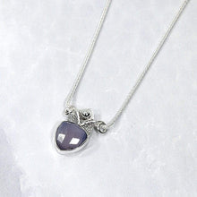 Load image into Gallery viewer, With its curling vines and hand textured petal, the Fleur necklace adds a touch of romance to your look. The checker cut Lilac Chalcedony has a soft purple glow and just the right amount of sparkle.