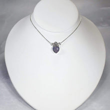 Load image into Gallery viewer, With its curling vines and hand textured petal, the Fleur necklace adds a touch of romance to your look. The checker cut Lilac Chalcedony has a soft purple glow and just the right amount of sparkle.