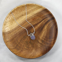 Load image into Gallery viewer, With its curling vines and hand textured petal, the Fleur necklace adds a touch of romance to your look. The checker cut Lilac Chalcedony has a soft purple glow and just the right amount of sparkle.
