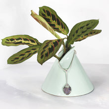 Load image into Gallery viewer, Eloise is a charming y-shaped necklace with a lovely faceted Lilac Chalcedony. Hand carved texture balances out the geometric shapes framing the stone.