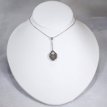 Load image into Gallery viewer, Eloise is a charming y-shaped necklace with a lovely faceted Lilac Chalcedony. Hand carved texture balances out the geometric shapes framing the stone.