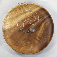 Load image into Gallery viewer, Eloise is a charming y-shaped necklace with a lovely faceted Lilac Chalcedony. Hand carved texture balances out the geometric shapes framing the stone.