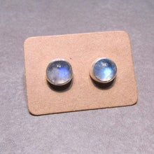 Load image into Gallery viewer, These sweet little studs feature ethically sourced rainbow moonstones set in a simple recycled silver bezel. At 9mm wide, they are the perfect size for everyday wear while still adding a flash of shimmer to your look! Solid sterling studs and surgical steel butterfly backings provide a secure fit for sensitive skin. These moondrops come in a range of colours from pearly white to twilight blue so you can pick your perfect pair!