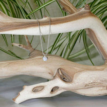 Load image into Gallery viewer, This Rainbow Moonstone choker is for someone who wants an especially close-fitting necklace. At just 15” long, the sterling silver wheat chain allows the pale green and aqua moonstone to rest right at the base of the throat.