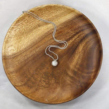 Load image into Gallery viewer, This Rainbow Moonstone choker is for someone who wants an especially close-fitting necklace. At just 15” long, the sterling silver wheat chain allows the pale green and aqua moonstone to rest right at the base of the throat.