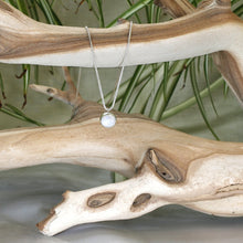 Load image into Gallery viewer, This 11mm Luna necklace features a beautiful round Rainbow Moonstone simply set in a smooth silver bezel. A silver wheat chain completes the clean, classic look you will find yourself wearing over and over.