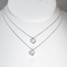 Load image into Gallery viewer, This 9mm Luna necklace features a beautiful round Rainbow Moonstone simply set in a smooth silver bezel. A simple oval chain completes the clean, classic look you will find yourself wearing over and over.