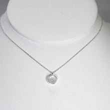 Load image into Gallery viewer, This 9mm Luna necklace features a beautiful round Rainbow Moonstone simply set in a smooth silver bezel. A simple oval chain completes the clean, classic look you will find yourself wearing over and over.