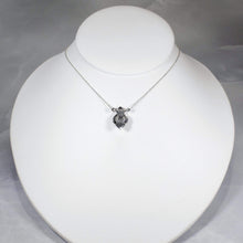 Load image into Gallery viewer, Hand-shaped silver tendrils allow this Fleur pendant to glide along its dainty oval chain. A narrow round bezel band and silver pebbles accent the violet-blue flash of the Moonstone.