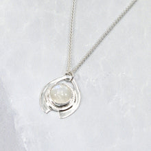 Load image into Gallery viewer, One part portal and one part shield talisman, this aqua blue Labradorite Deidra is all sleek elegance and high shine. Details: Solid sterling silver, partially recycled Natural Labradorite cabochon Pendant: 30 x 27mm 18” long Sterling Silver chain plus 2” Extender Handmade s-hook clasp