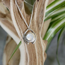 Load image into Gallery viewer, One part portal and one part shield talisman, this aqua blue Labradorite Deidra is all sleek elegance and high shine. Details: Solid sterling silver, partially recycled Natural Labradorite cabochon Pendant: 30 x 27mm 18” long Sterling Silver chain plus 2” Extender Handmade s-hook clasp