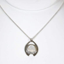 Load image into Gallery viewer, One part portal and one part shield talisman, this aqua blue Labradorite Deidra is all sleek elegance and high shine. Details: Solid sterling silver, partially recycled Natural Labradorite cabochon Pendant: 30 x 27mm 18” long Sterling Silver chain plus 2” Extender Handmade s-hook clasp