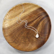 Load image into Gallery viewer, Simple and sweet, the Tess moonstone necklace is a jewel you will reach for over and over. A beautiful blue flash in the cloud-white stone set in a classic silver bezel adds the perfect touch of glam to this easy to wear necklace.