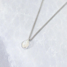 Load image into Gallery viewer, Simple and sweet, the Tess moonstone necklace is a jewel you will reach for over and over. A beautiful blue flash in the cloud-white stone set in a classic silver bezel adds the perfect touch of glam to this easy to wear necklace.