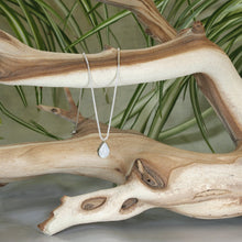 Load image into Gallery viewer, Simple and sweet, the Tess moonstone necklace is a jewel you will reach for over and over. A beautiful blue flash in the cloud-white stone set in a classic silver bezel adds the perfect touch of glam to this easy to wear necklace.