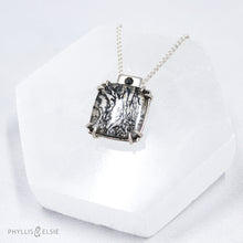 Load image into Gallery viewer, A glamorous Dendritic Quartz held by 8 tapered prongs is capped with a flush set Black Spinel and slides on a sleek silver wheat chain  Details  Solid sterling silver, partially recycled  Dendritic Quartz, Black Spinel  Pendant: 17mm x 22mm  16" Sterling chain, adjustable to 18"  Lobster claw clasp
